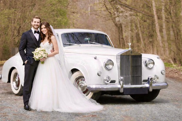 Luxury wedding getaway car Boston at night for bride and groom